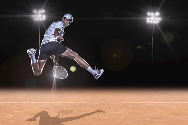 Tennis player reaching for the hard ball — Stock Photo, Image