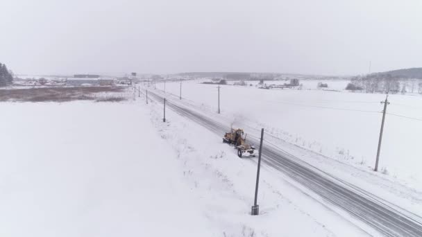 Vista Aérea Soprador Neve Grader Clears Snow Covered Country Road — Vídeo de Stock