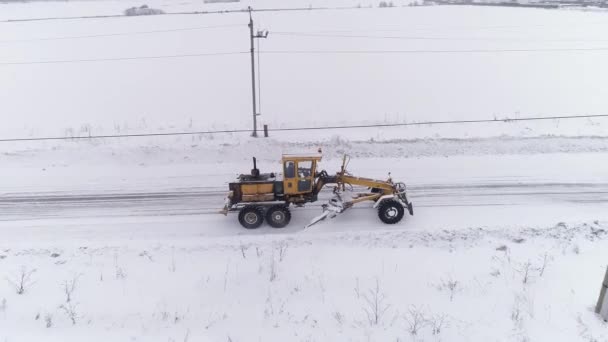 Vista Aérea Soprador Neve Grader Clears Snow Covered Country Road — Vídeo de Stock