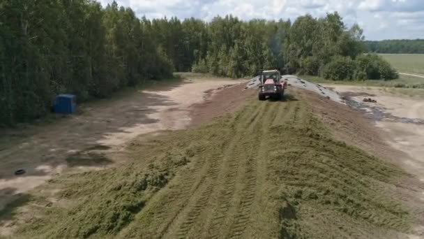 Drone View Tractor Tamp Silage Silo Trench Next Forest Field — Stockvideo