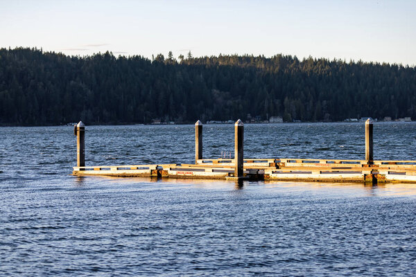 Hood canal with wooden dock leading out into water