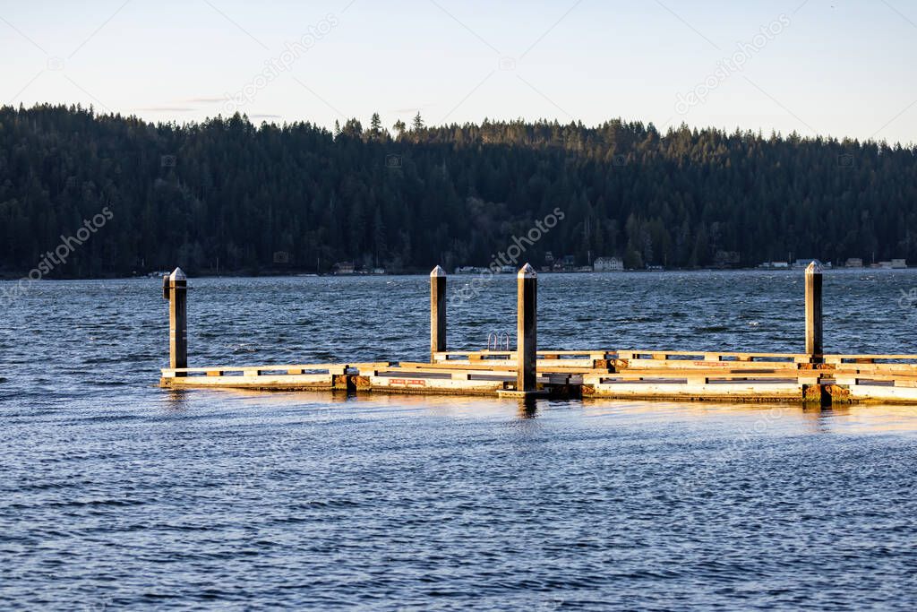 Hood canal with wooden dock leading out into water