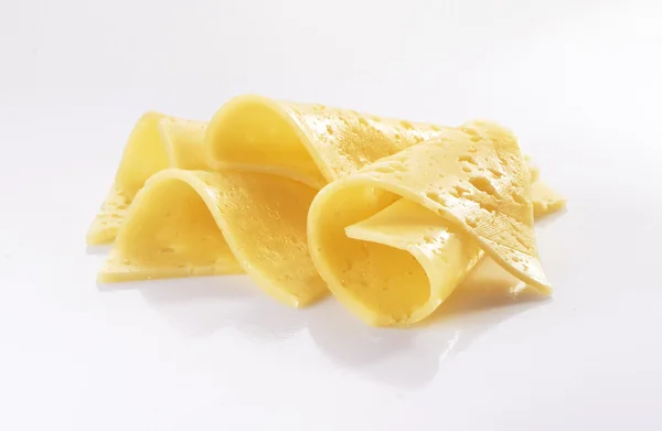 Τυρί φέτες σε λευκό φόντο — Φωτογραφία Αρχείου