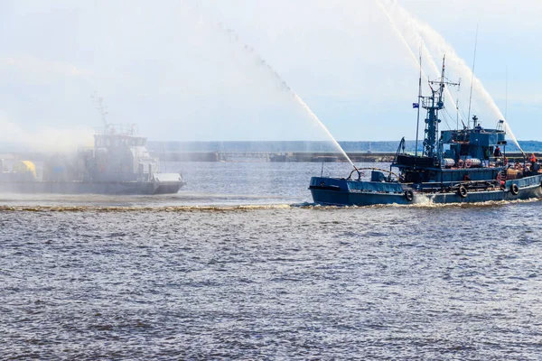 Extinguishing a burning ship during naval exercises