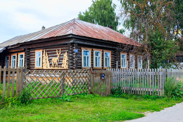 Old wooden log house in a russian village