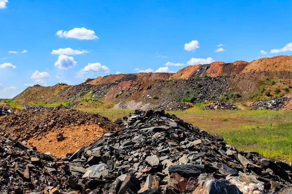 View of slag heaps of iron ore quarry. Mining industry