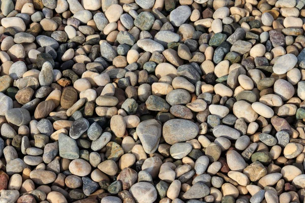 滑らかな丸い小石の質感の背景 ペブルシービーチ近く — ストック写真