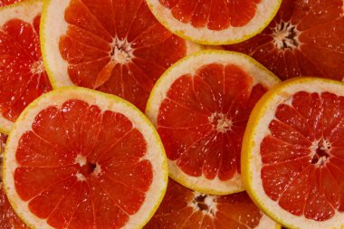 Arkaplan olarak taze greyfurt dilimleri