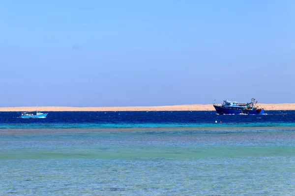 Fishing trawler and old fishing boat sails at Red sea in Hurghada, Egypt