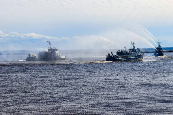 Extinguishing a burning ship during naval exercises