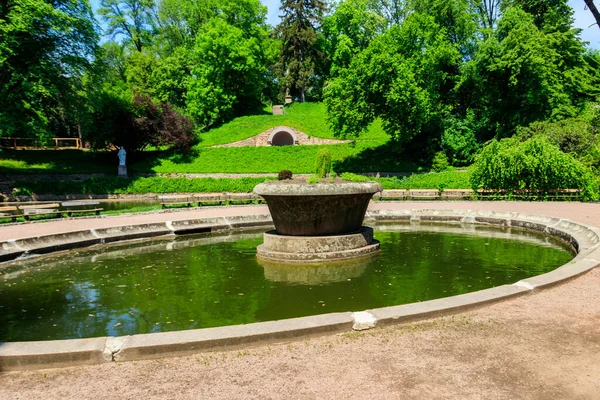 Large stone flower bed in the middle of artificial pond in Sofiyivka park in Uman, Ukraine