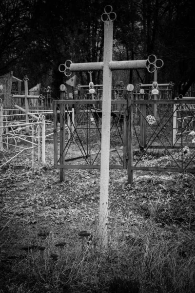 Old cross in graveyard. Black and white tone