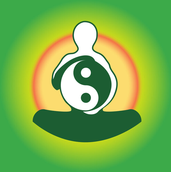 Symbol Yin Yan in hands of the person against a sunset.