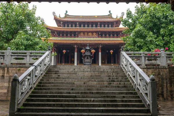 Chinese traditional Buddhist architecture in the rain, the plaque reads \