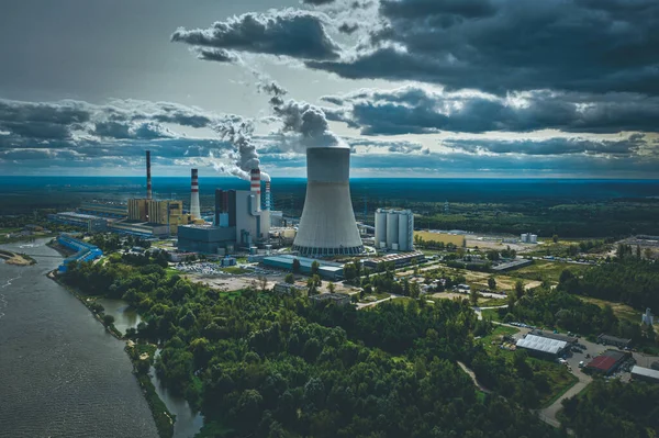 Power station under moody cloudy sky aerial view