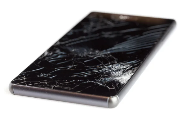 Broken cellphone isolated on white background