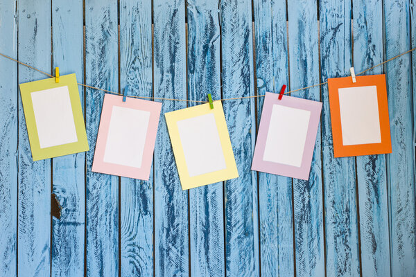 Blank photos hanging on a clothesline