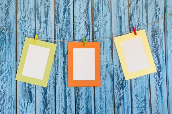 Blank photos hanging on a clothesline