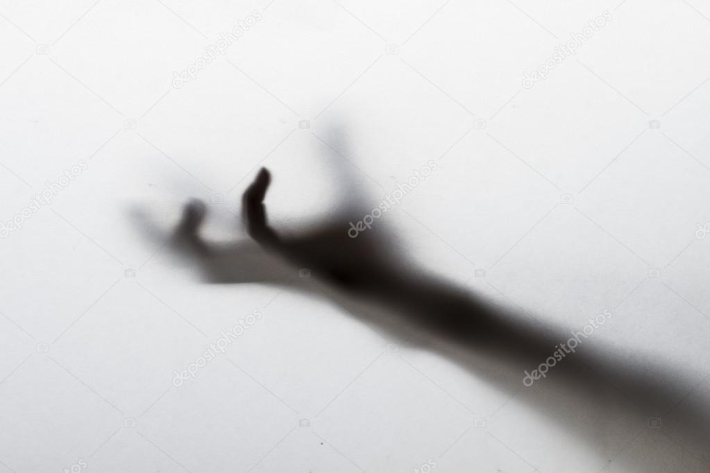 Silhouette of creepy hand