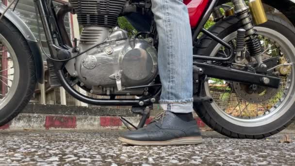 Young Biker Shoe Confidently Lifts Side Stand Motorcycle Close Range — Stock Video