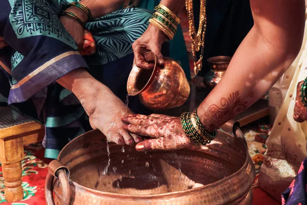 Drops of Water On Leg Of Mother-in-law In Wedding Ceremony. Indian Wedding Ceremony And Rituals. Maharashtra Wedding. Marathi Wedding. Indian Culture