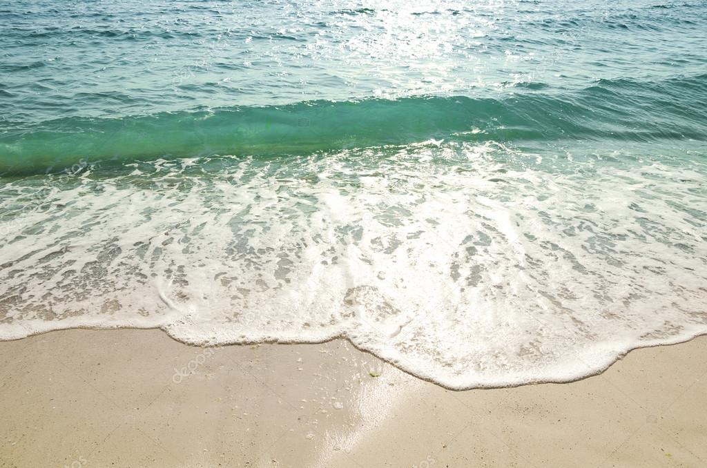 Wave of the sea on the sand beach