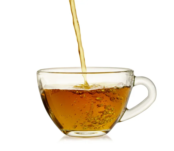 Tea is poured into a mug  isolated on white background. — Stock Photo, Image