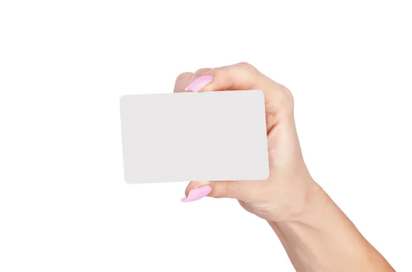 Mano femenina con una tarjeta en blanco aislada sobre fondo blanco . — Foto de Stock