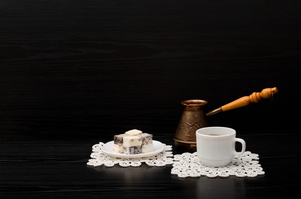 Mug of coffee, Turkish delight and Cezve on a black background. Space for text — Stock Photo, Image