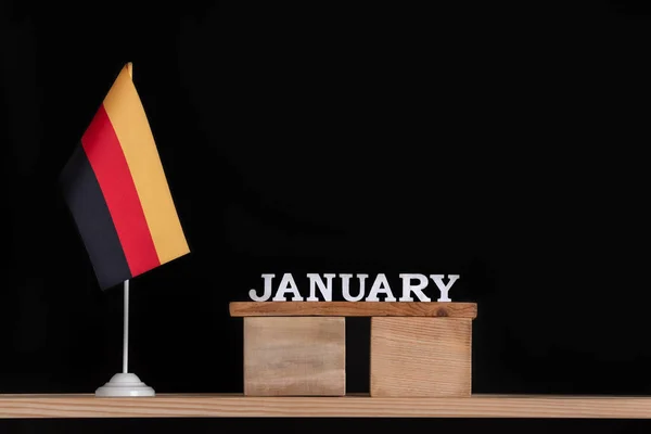 Dřevěný Lednový Kalendář Německou Vlajkou Černém Pozadí Svátky Němčiny Lednu — Stock fotografie