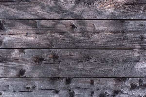 Old boards. Gray wood. Natural wood texture. Abstract wooden background.