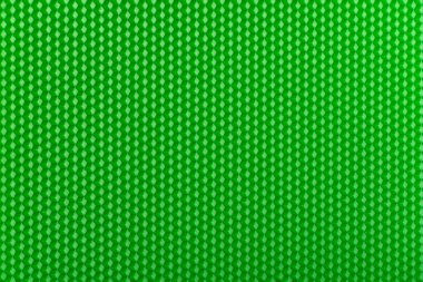 Fütürist yüzey. Parlak yeşil geometrik bal peteği arka planı. Şablon.