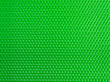 Fütürist yüzey. Parlak yeşil geometrik bal peteği arka planı. Şablon.