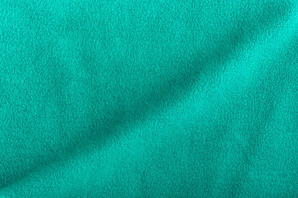 Groene Fleece Achtergrond Met Golf Oppervlakte Stof Textiel — Stockfoto