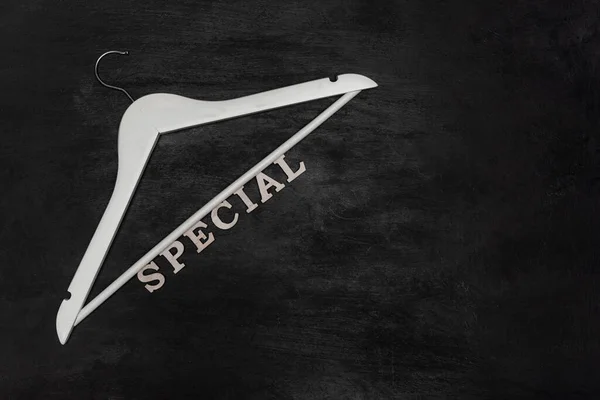 White Hanger Text Special Black Background Discounts Seasonal Sale Special — Zdjęcie stockowe