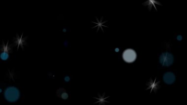 Yumuşak odaklı ışık çemberleri ve yıldız parçacıkları koyu arkaplan üzerinde - döngü simülasyon hareketi grafikleri ögesi Noel kutlaması arka planı