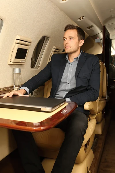 Man in the chair of business jet