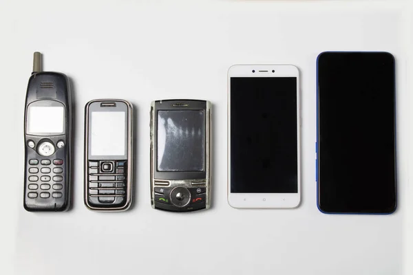 Evolución Los Teléfonos Celulares Sobre Fondo Blanco Fotos de stock