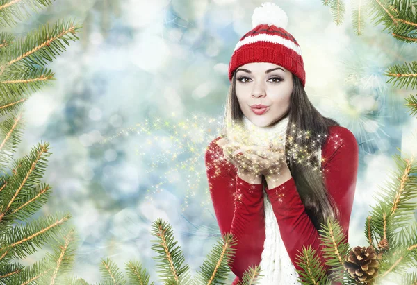 Beautiful brunette girl blowing star dust - christmas portrait — Stock Photo, Image