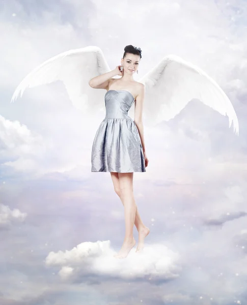 Beautiful brunette woman as angel in heaven — Stock Photo, Image