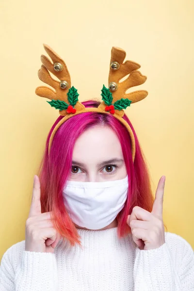 Woman White Sweater Deer Horns Wearing White Mask Points Fingers — Stock Photo, Image