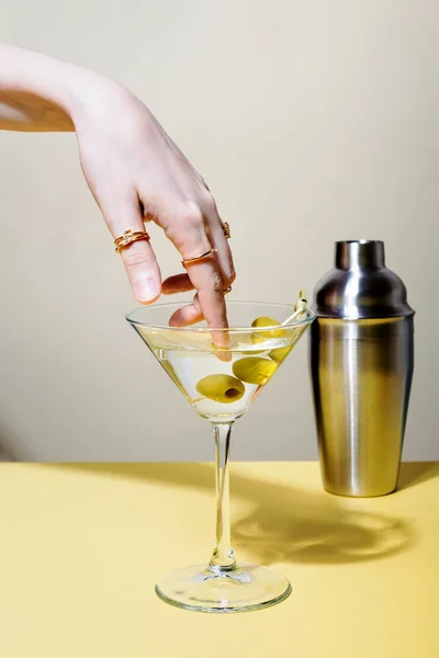 Woman Dips Finger Rings Glass Martini Cocktail Olives — Stock Photo, Image