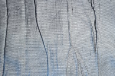 Gri kumaş arka plan ile kırışıklıklar kırışık