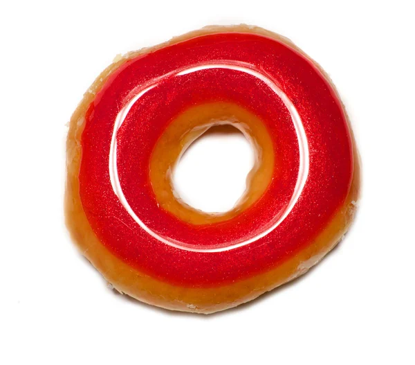 Красный глазурованный пончик — стоковое фото