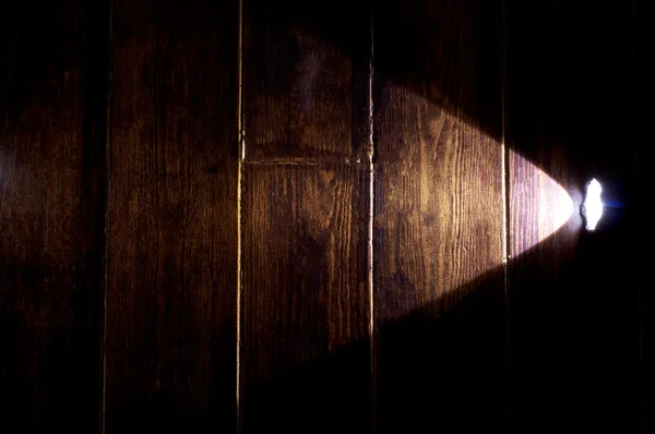 Flashlight on the wooden floor — Stock Photo, Image