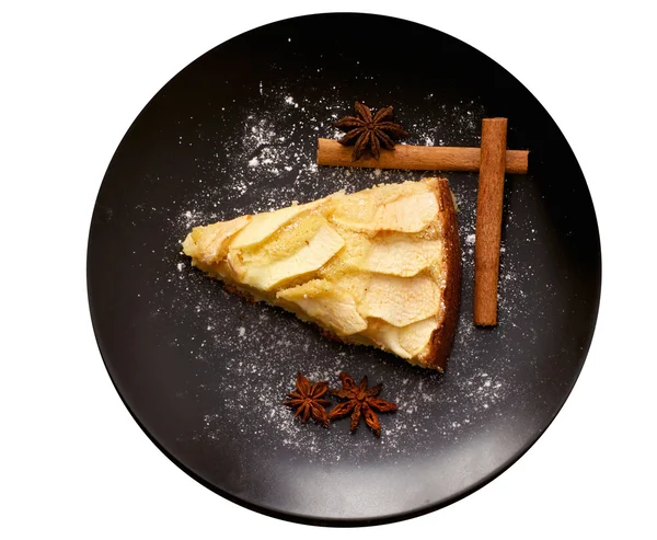 Isolated apple pie on the plate with cinnamon sticks — Stock Photo, Image