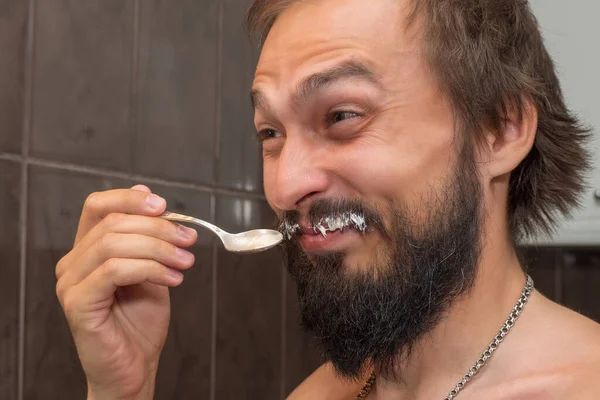 Bearded Man Eats Sour Cream While Smearing His Mustache — Stock Photo, Image