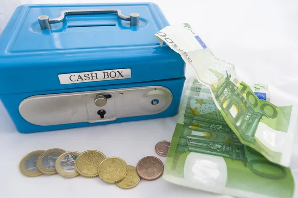 Stacks of euro coins and banknotes in a cash box — Stock Photo, Image