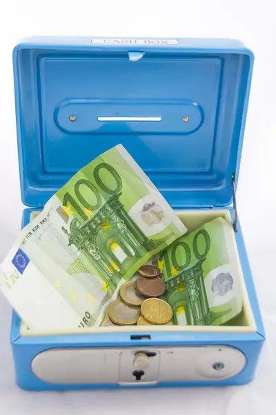 Stacks of euro coins and banknotes in a cash box — Stock Photo, Image