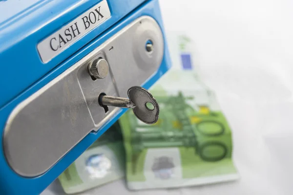 Stacks of euro coins and banknotes in a cash box — Stock Photo, Image